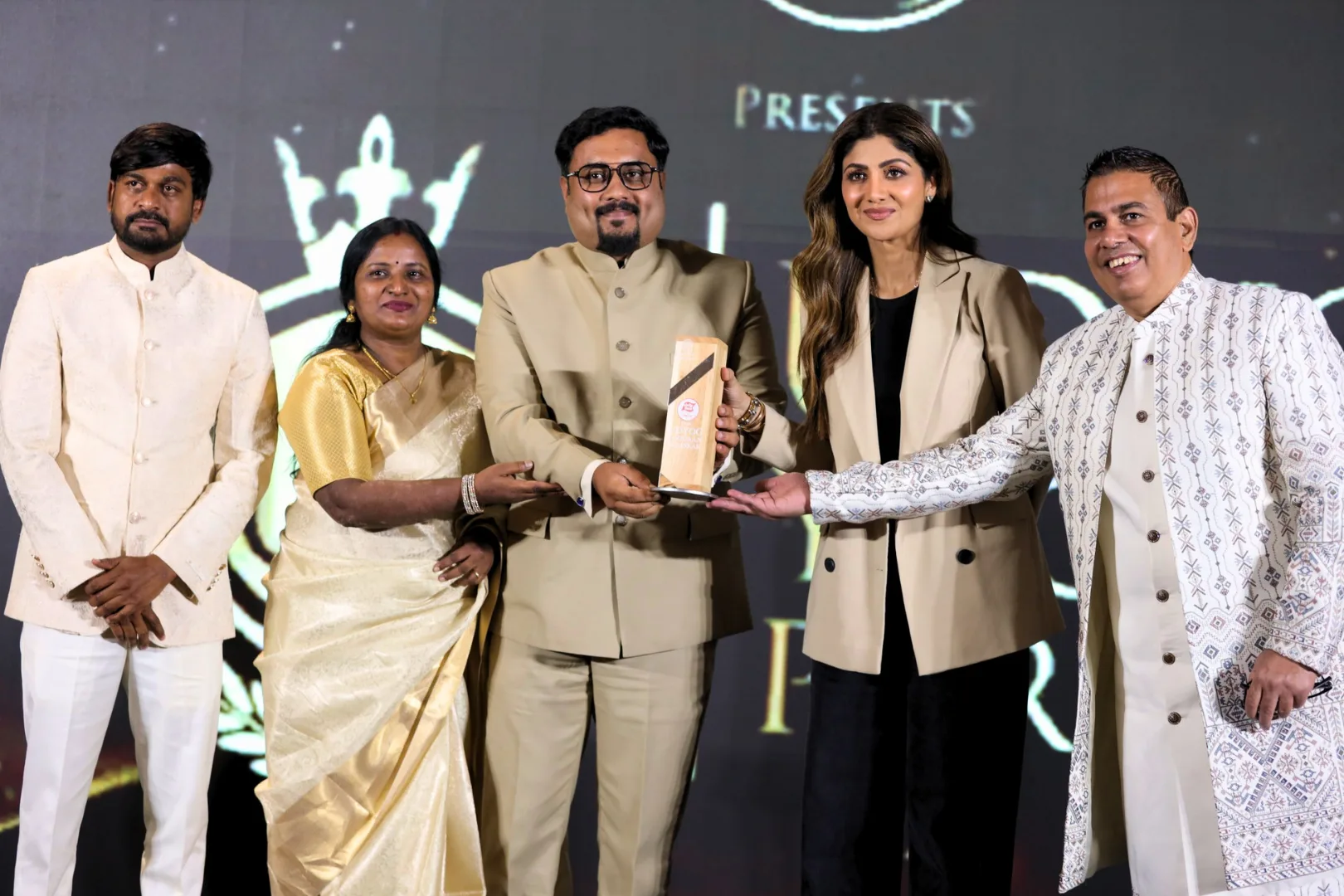 udhyog_yogdan_purushkar_mnm, MNM Enterprises Achievements showcasing completed construction projects